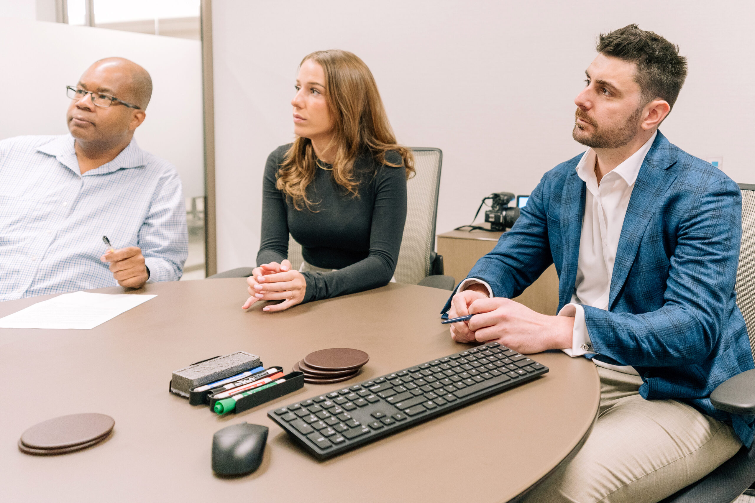 Employees in conference room looking up